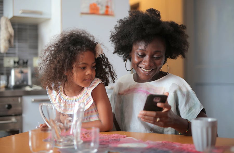 Mother and child looking at a mobile phone